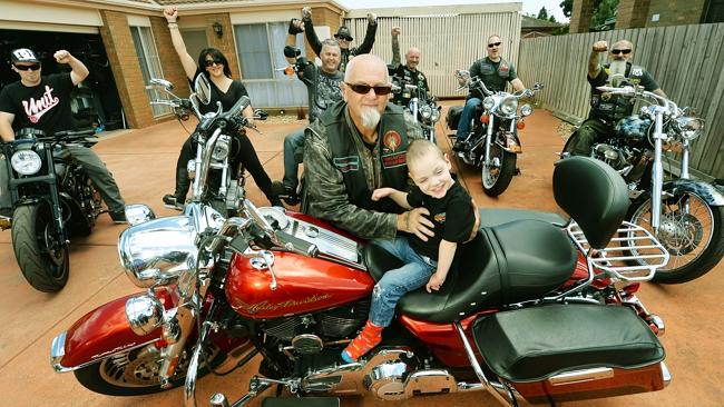 Highway Hog member Len gives Cooper a ride on his Harley Roadking touring bike