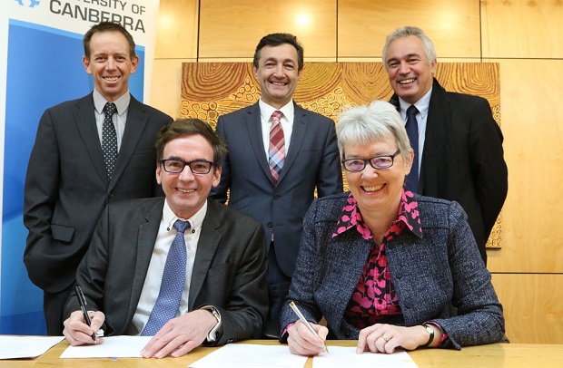 (L to R) front – Andrew McCrea, Managing Director of Cann Pharmaceutical Australia and Professor Frances Shannon, Acting Vice-Chancellor of the University of Canberra sign the research agreement. Supported by ACT Government Minister Shane Rattenbury MLA, Dr Braden McGrath, University of Canberra researcher and Professor Geoffrey Riordan, Dean of the Faculty of Education, Science, Technology, Engineering and Mathematics. Photo: Kim Pham.