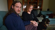 Matthew and Elizabeth Pallett at home with their dog Champ. Photo: Joe Armao  