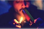 Guy inhaling on bong
